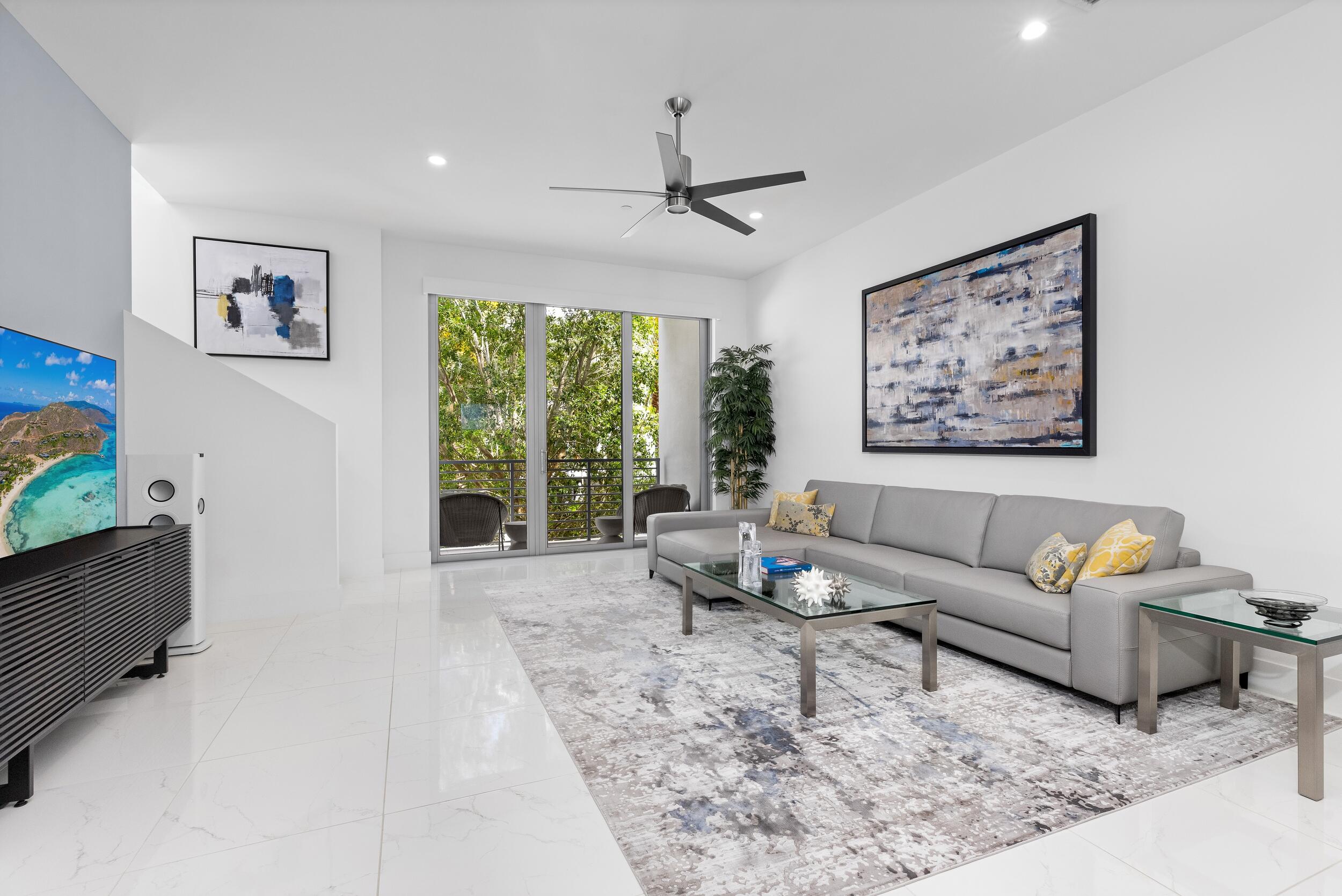 1851 Northwest 40th Drive Boca Raton, FL 33431 - Photo 22 of 42 a living room with furniture and a large window