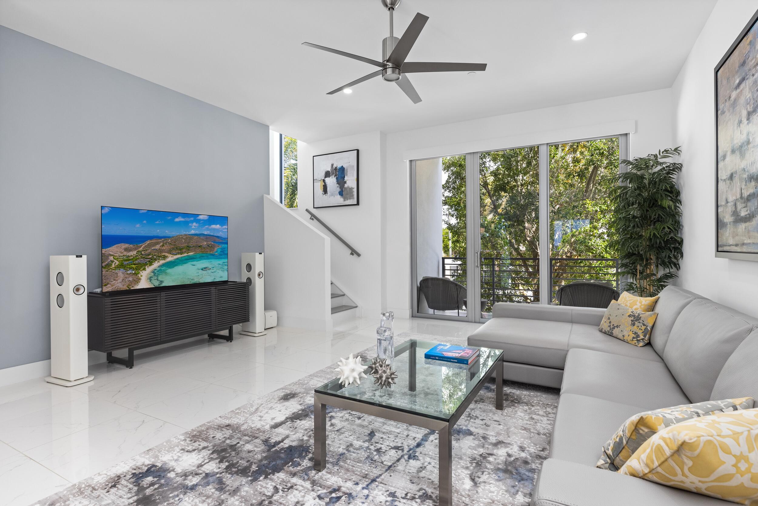1851 Northwest 40th Drive Boca Raton, FL 33431 - Photo 25 of 42 a living room with furniture and a flat screen tv