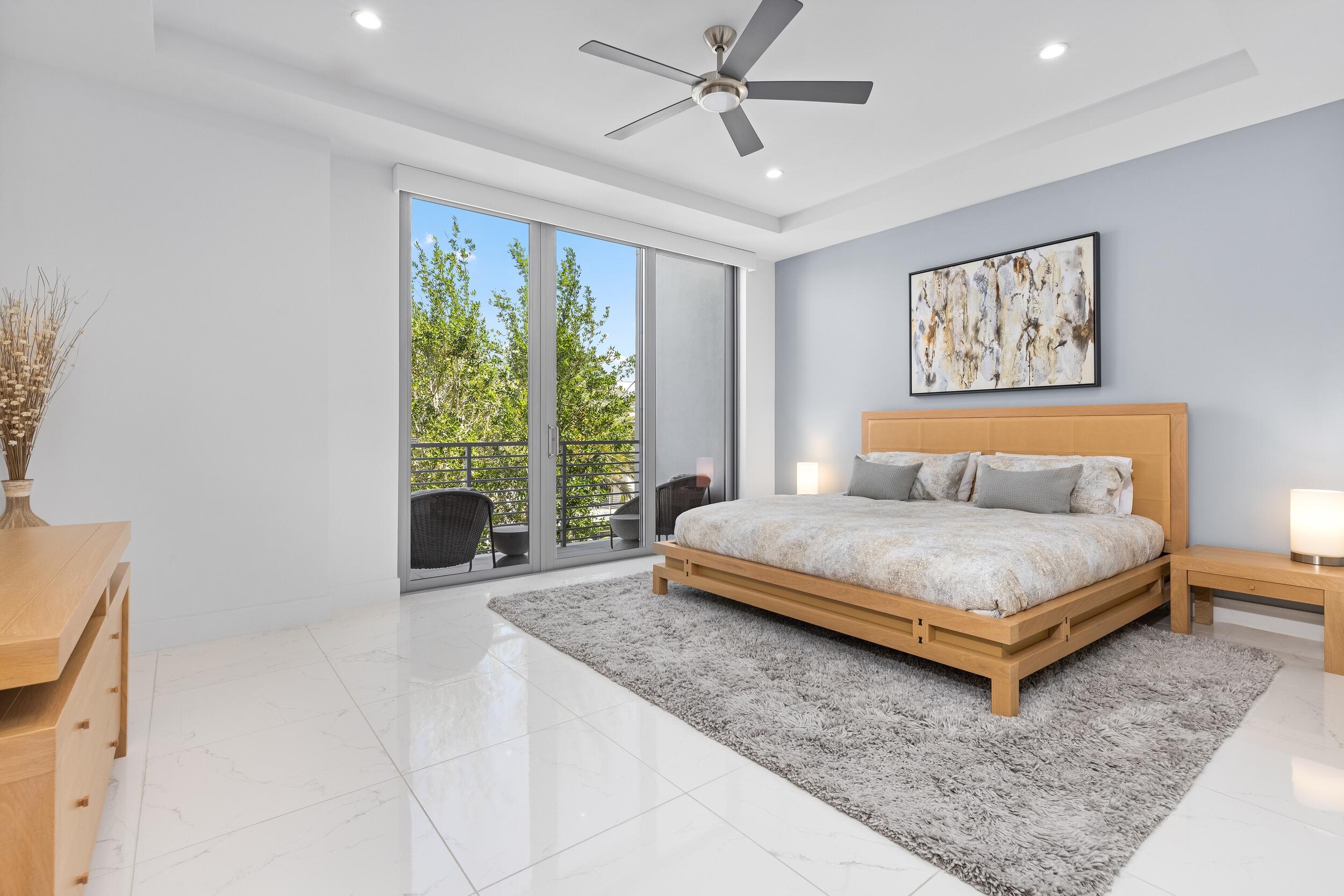 1851 Northwest 40th Drive Boca Raton, FL 33431 - Photo 26 of 42 a bedroom with a bed and window