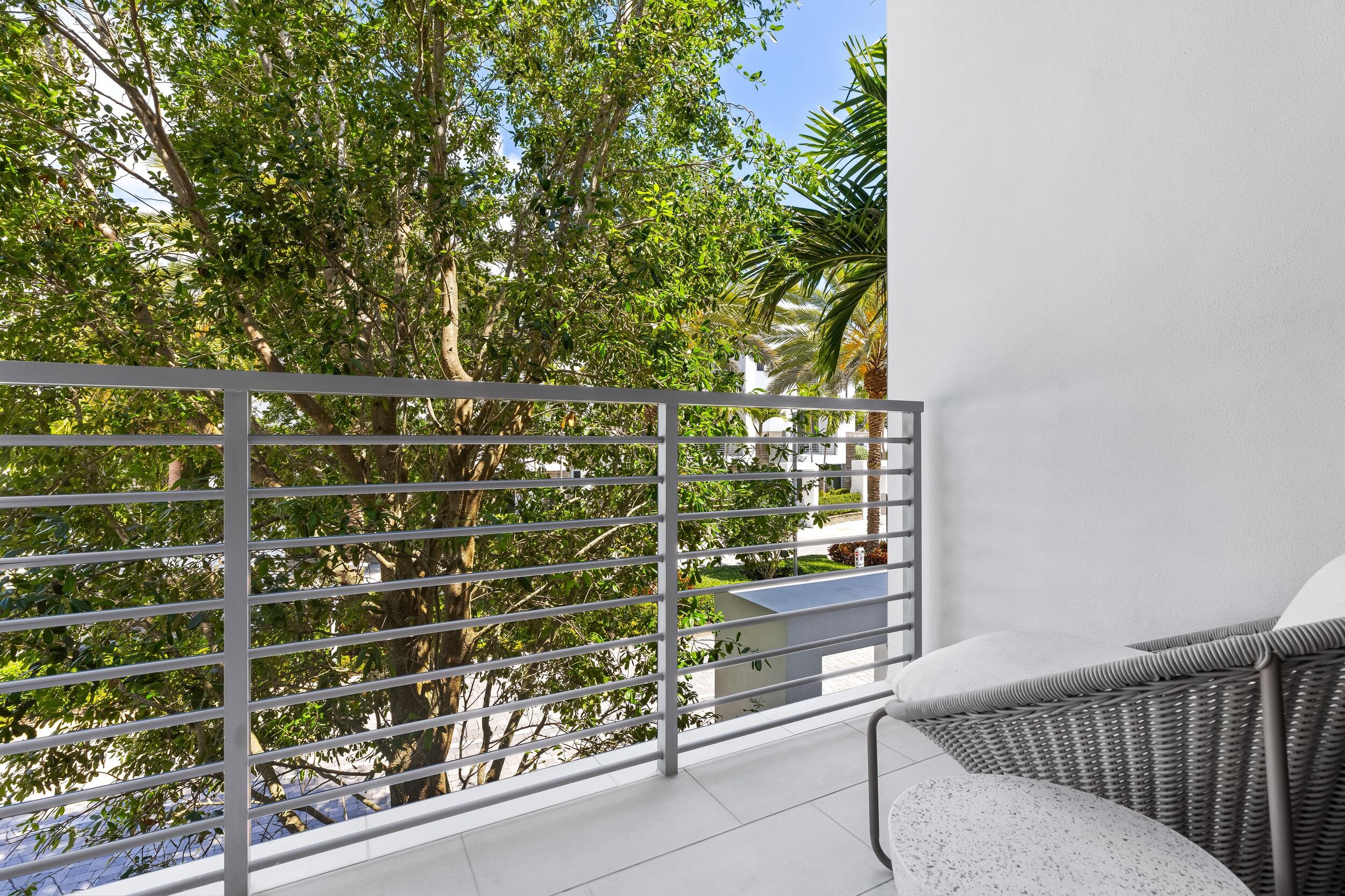 1851 Northwest 40th Drive Boca Raton, FL 33431 - Photo 27 of 42 a view of a balcony with a tree