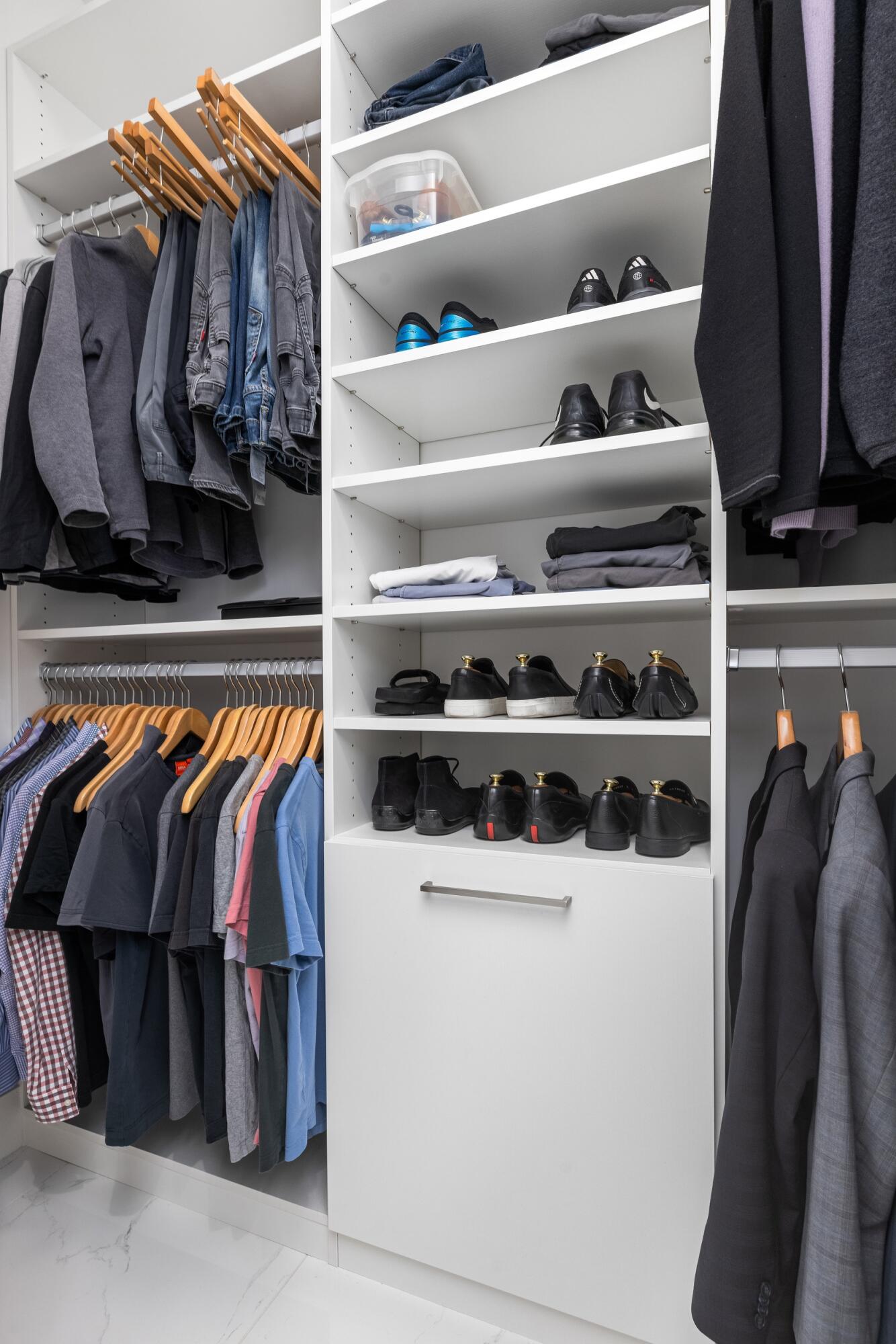 1851 Northwest 40th Drive Boca Raton, FL 33431 - Photo 29 of 42 a view of walk in closet with clothes and shoes