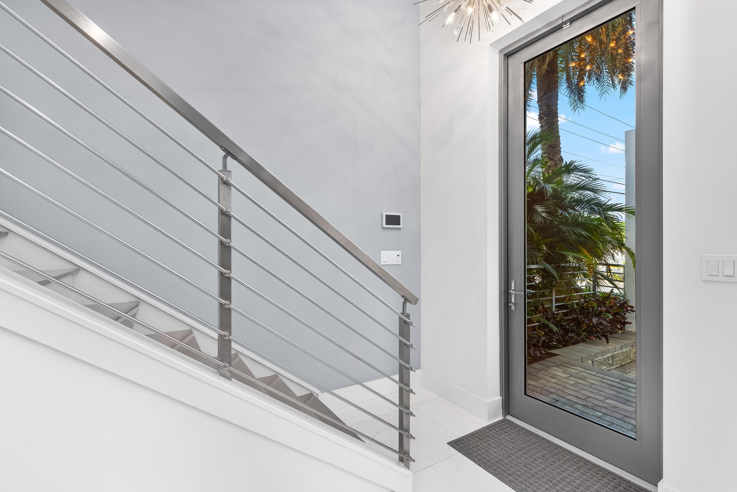 1851 Northwest 40th Drive Boca Raton, FL 33431 - Photo 3 of 42 a view of wooden door