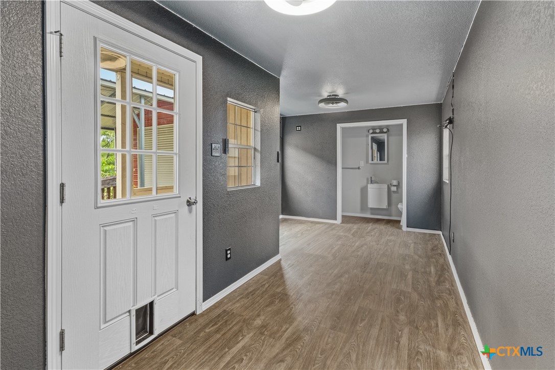 283 County Road 4710 Kempner, TX 76539 - Photo 43 of 47 wooden floor and windows in a room
