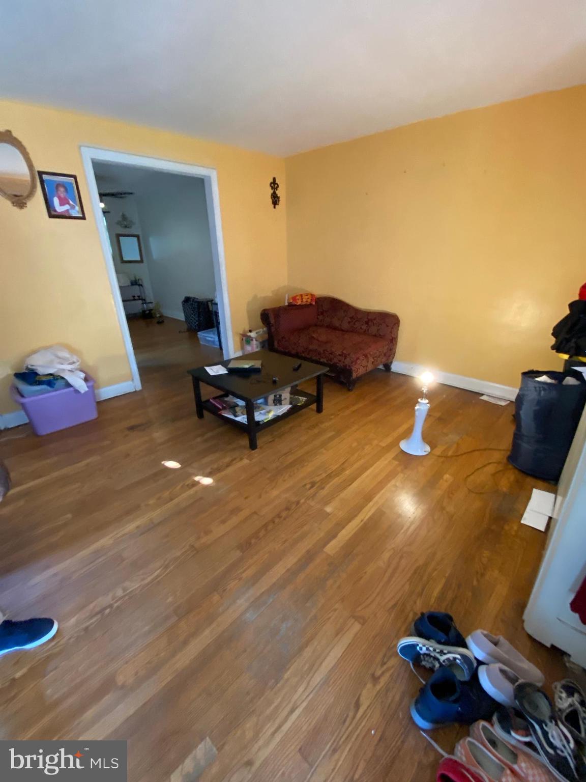 450 Random Road Baltimore, MD 21229 - Photo 2 of 17 a living room with furniture and a flat screen tv