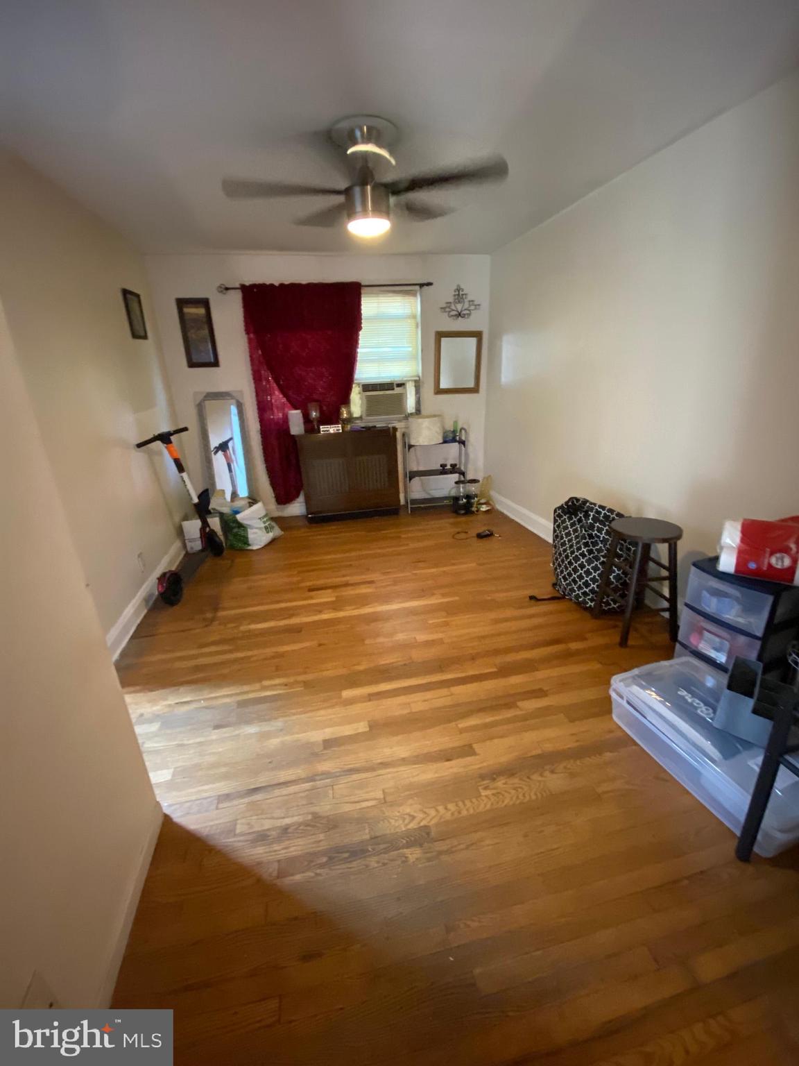 450 Random Road Baltimore, MD 21229 - Photo 3 of 17 a room with furniture and a wooden floor