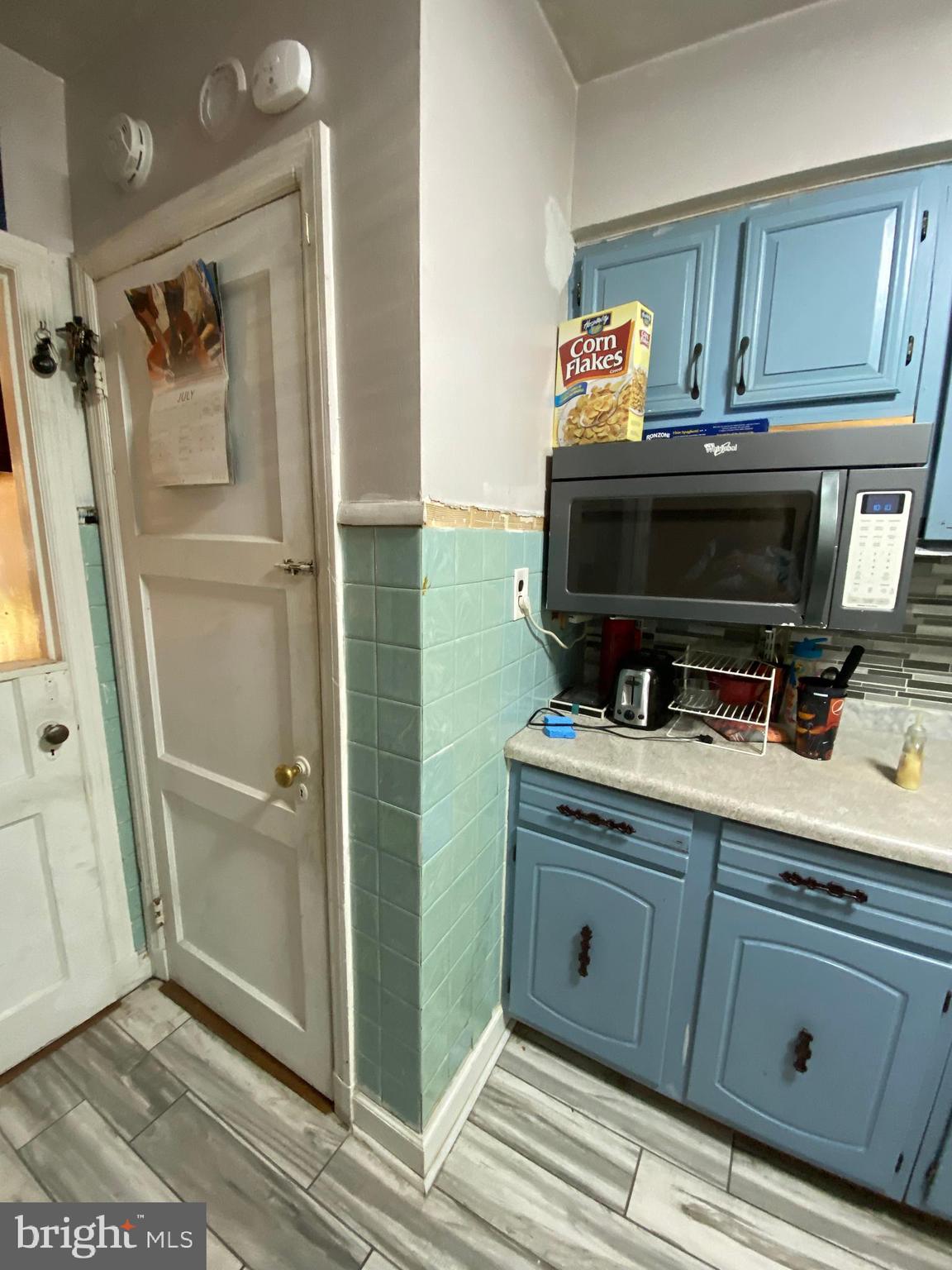 450 Random Road Baltimore, MD 21229 - Photo 4 of 17 a bathroom with a sink a mirror and a shower
