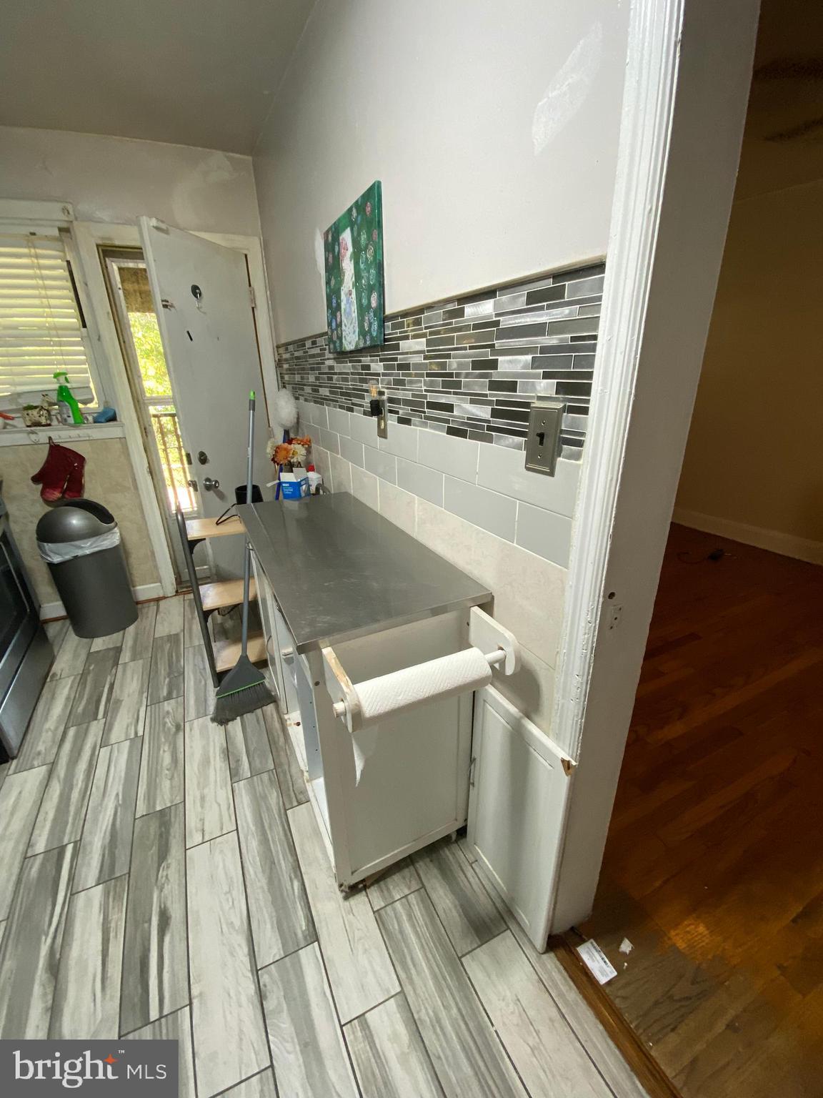 450 Random Road Baltimore, MD 21229 - Photo 6 of 17 a room with wooden floor and furniture