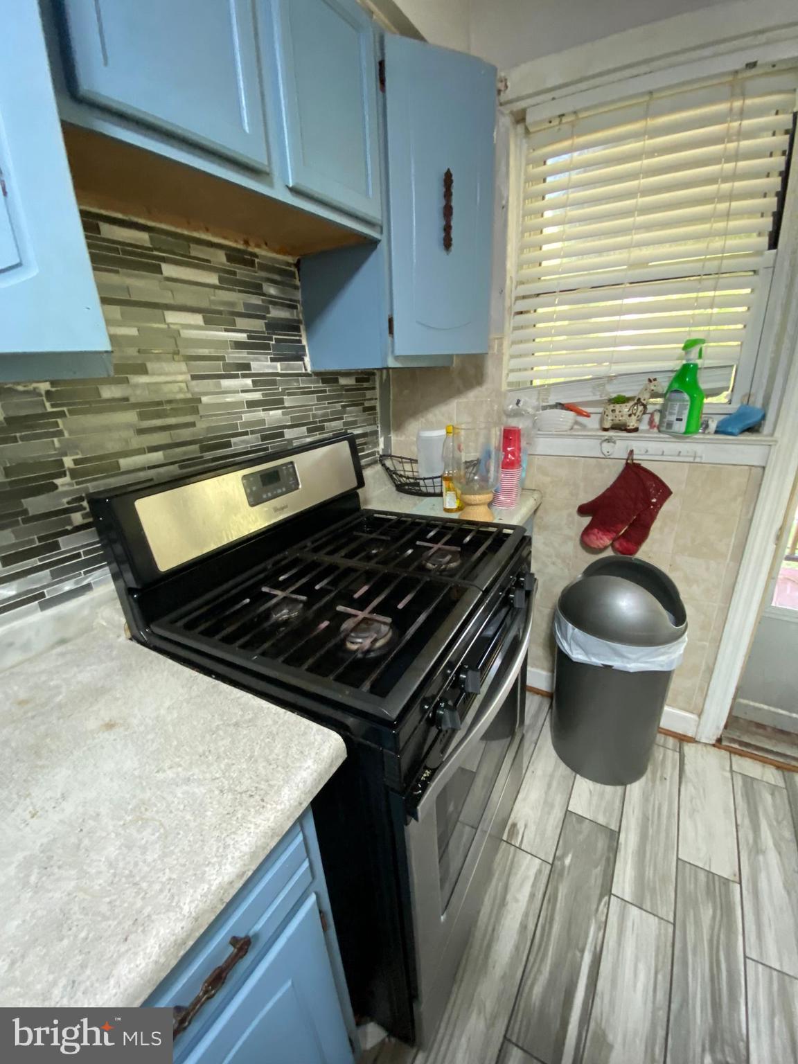 450 Random Road Baltimore, MD 21229 - Photo 7 of 17 a kitchen with a stove and a sink
