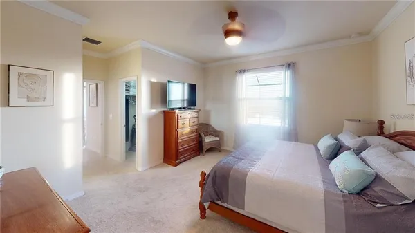 a bedroom with bed and window