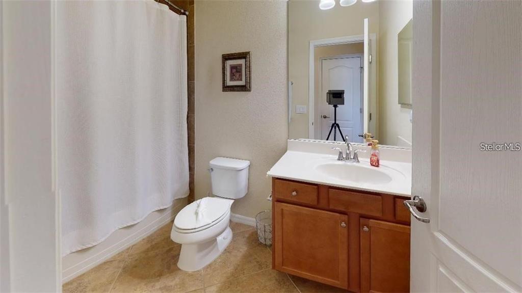 12659 Richezza Drive Venice, FL 34293 - Photo 15 of 42 a bathroom with a sink a toilet and shower