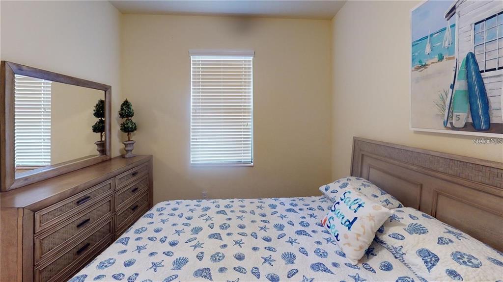 12659 Richezza Drive Venice, FL 34293 - Photo 17 of 42 a bedroom with a bed and a window