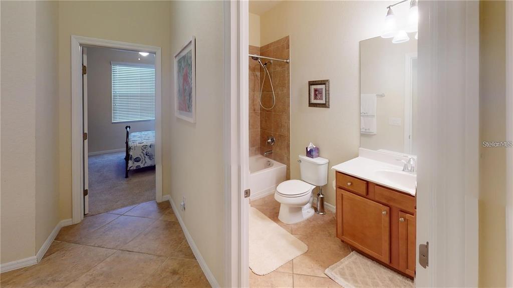 12659 Richezza Drive Venice, FL 34293 - Photo 21 of 42 a bathroom with a sink a toilet and shower