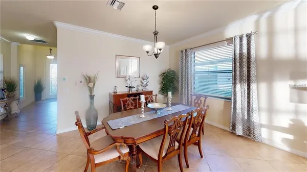 a dining room with furniture and window