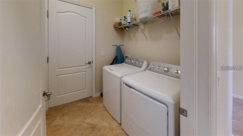 12659 Richezza Drive Venice, FL 34293 - Photo 23 of 42 a utility room with dryer and washer