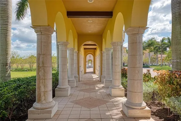 a front view of a house with a fountain