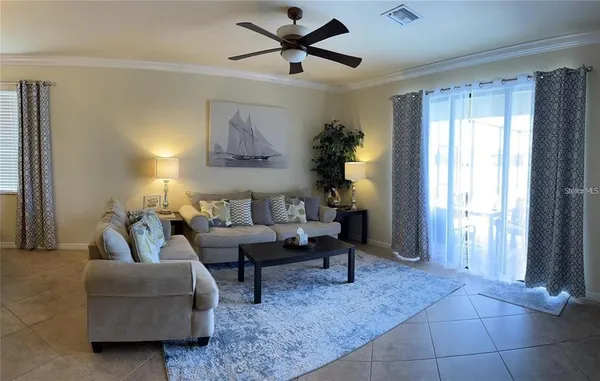 a living room with furniture and a window