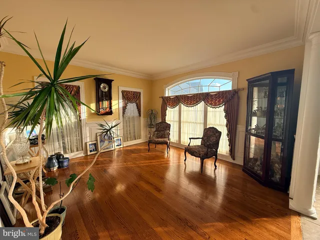 a view of a livingroom with furniture and hardwood floor