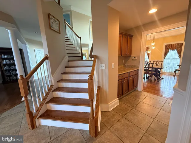a view of entryway and hall with dining area