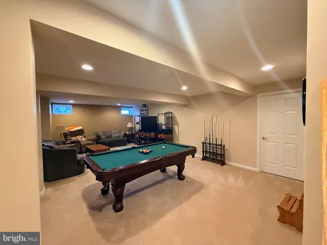 a room with furniture and air hockey table