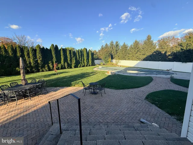 a view of a playground with green yard