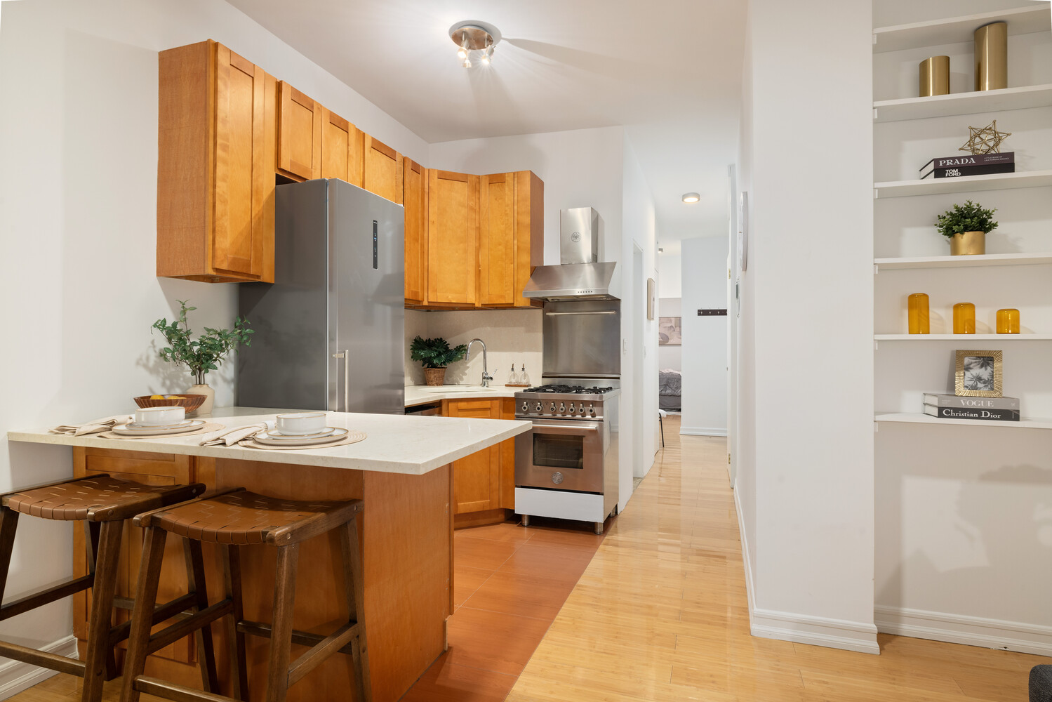 66 West 84th Street, Unit 3F Manhattan, NY 10024 - Photo 2 of 6 a kitchen with stainless steel appliances granite countertop a stove a sink dishwasher and a refrigerator with wooden floor