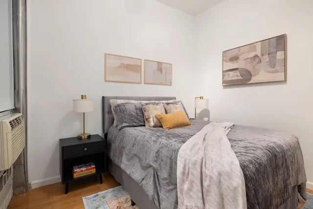 a living room with furniture potted plant and bathroom