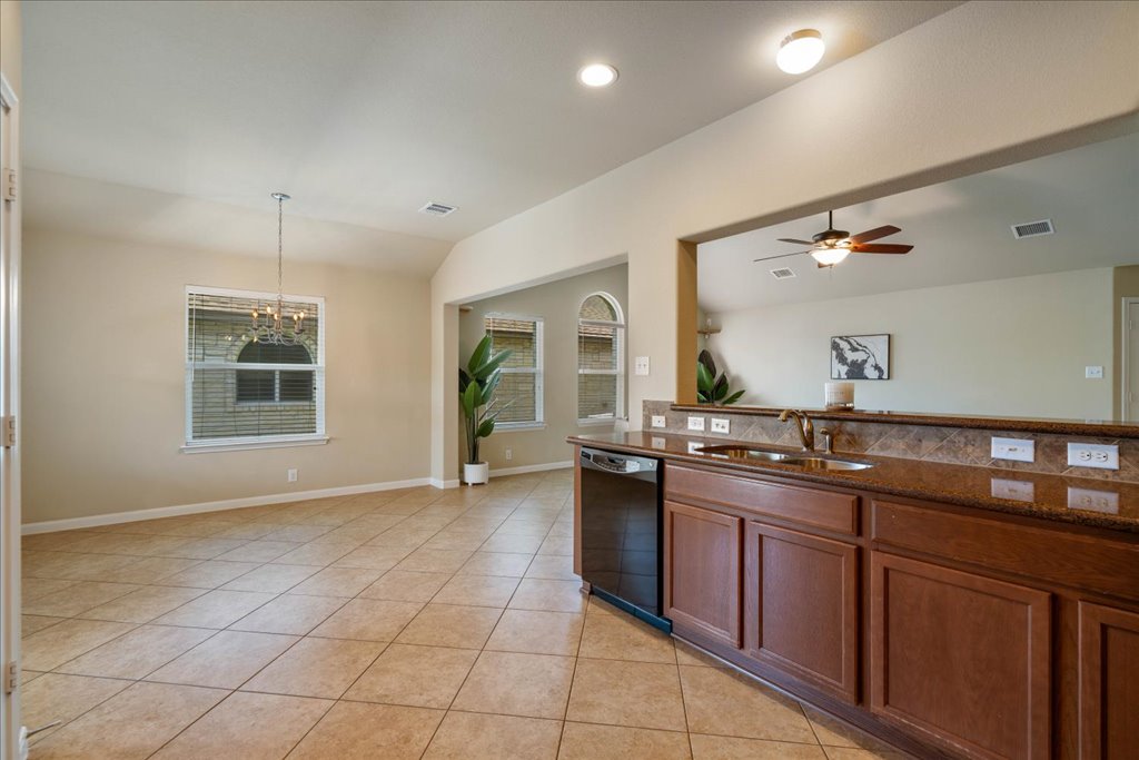 1810 Laminar Creek Road Cedar Park, TX 78613 - Photo 13 of 25 a kitchen with a sink and cabinets