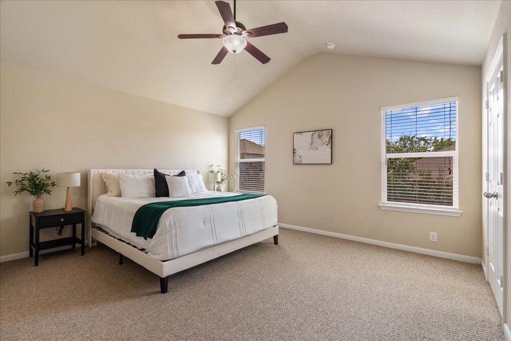 1810 Laminar Creek Road Cedar Park, TX 78613 - Photo 14 of 25 a bed room with a bed and a ceiling fan