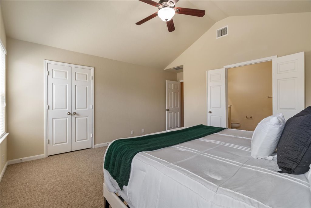 1810 Laminar Creek Road Cedar Park, TX 78613 - Photo 15 of 25 a bedroom with a bed and a ceiling fan