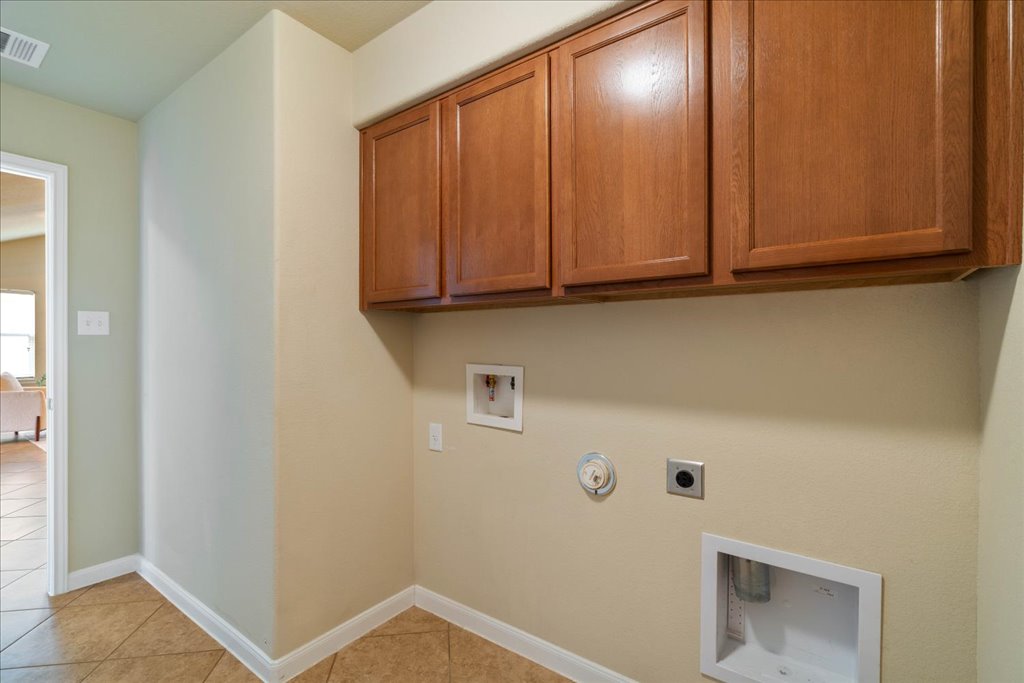 1810 Laminar Creek Road Cedar Park, TX 78613 - Photo 18 of 25 a view of storage and utility room with washer and dryer