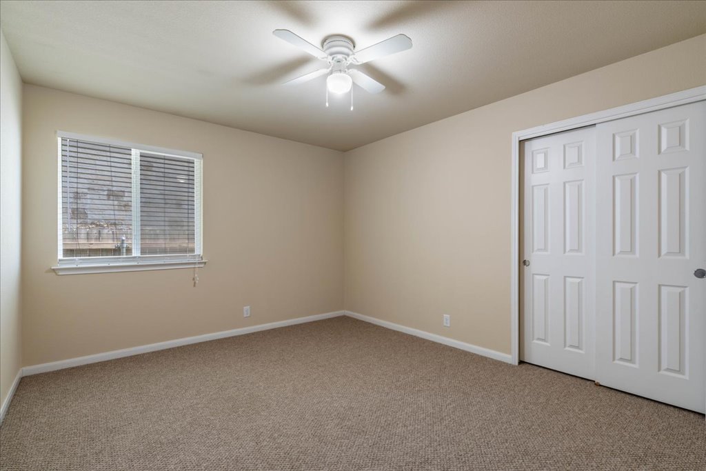 1810 Laminar Creek Road Cedar Park, TX 78613 - Photo 19 of 25 a view of a livingroom with a ceiling fan and window