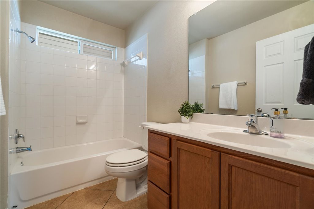 1810 Laminar Creek Road Cedar Park, TX 78613 - Photo 20 of 25 a bathroom with a sink a toilet and a bathtub