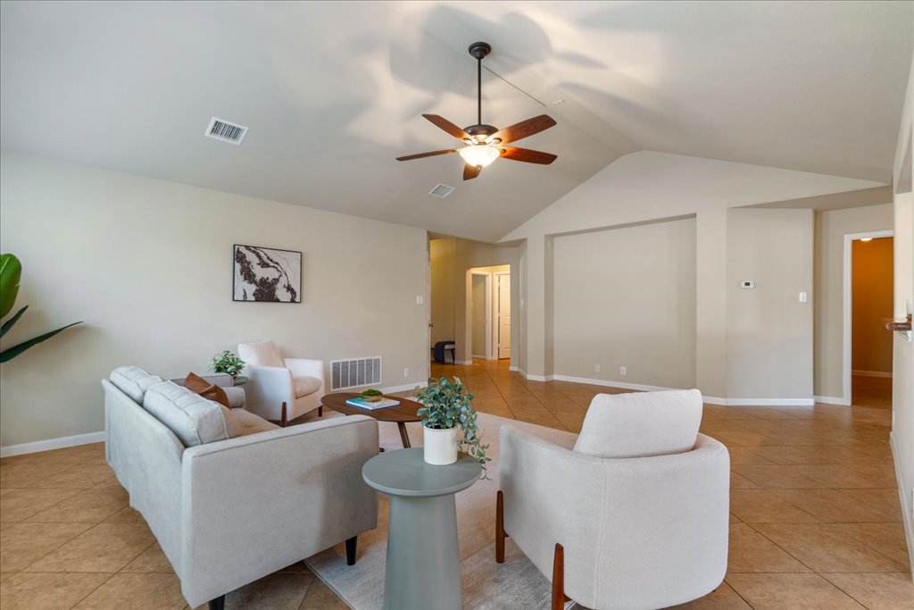 1810 Laminar Creek Road Cedar Park, TX 78613 - Photo 7 of 25 a living room with furniture and a chandelier