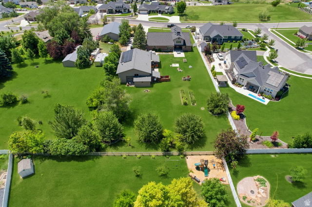 580 North 300 East Logan, UT 84321 - Photo 9 of 74 Expansive green landscape featuring mature trees and a manicured lawn