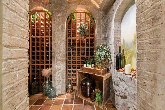 a bathroom with a granite countertop sink mirror and bathtub