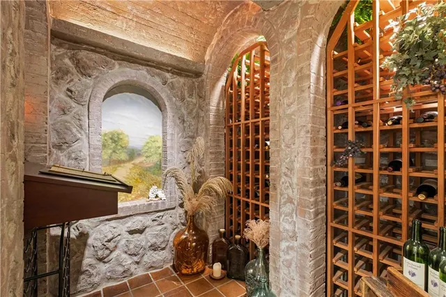 a spacious bathroom with a tub sink and mirror