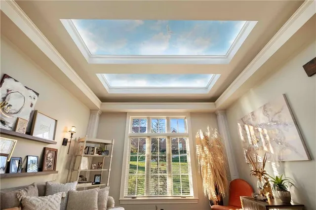 a view of a patio with a table and chairs and potted plants