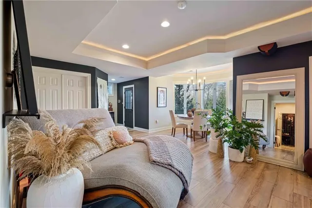 a living room with furniture and a floor to ceiling window