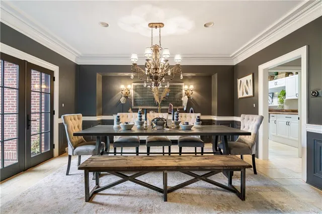 a kitchen with stainless steel appliances granite countertop a stove a sink dishwasher and cabinets with wooden floor