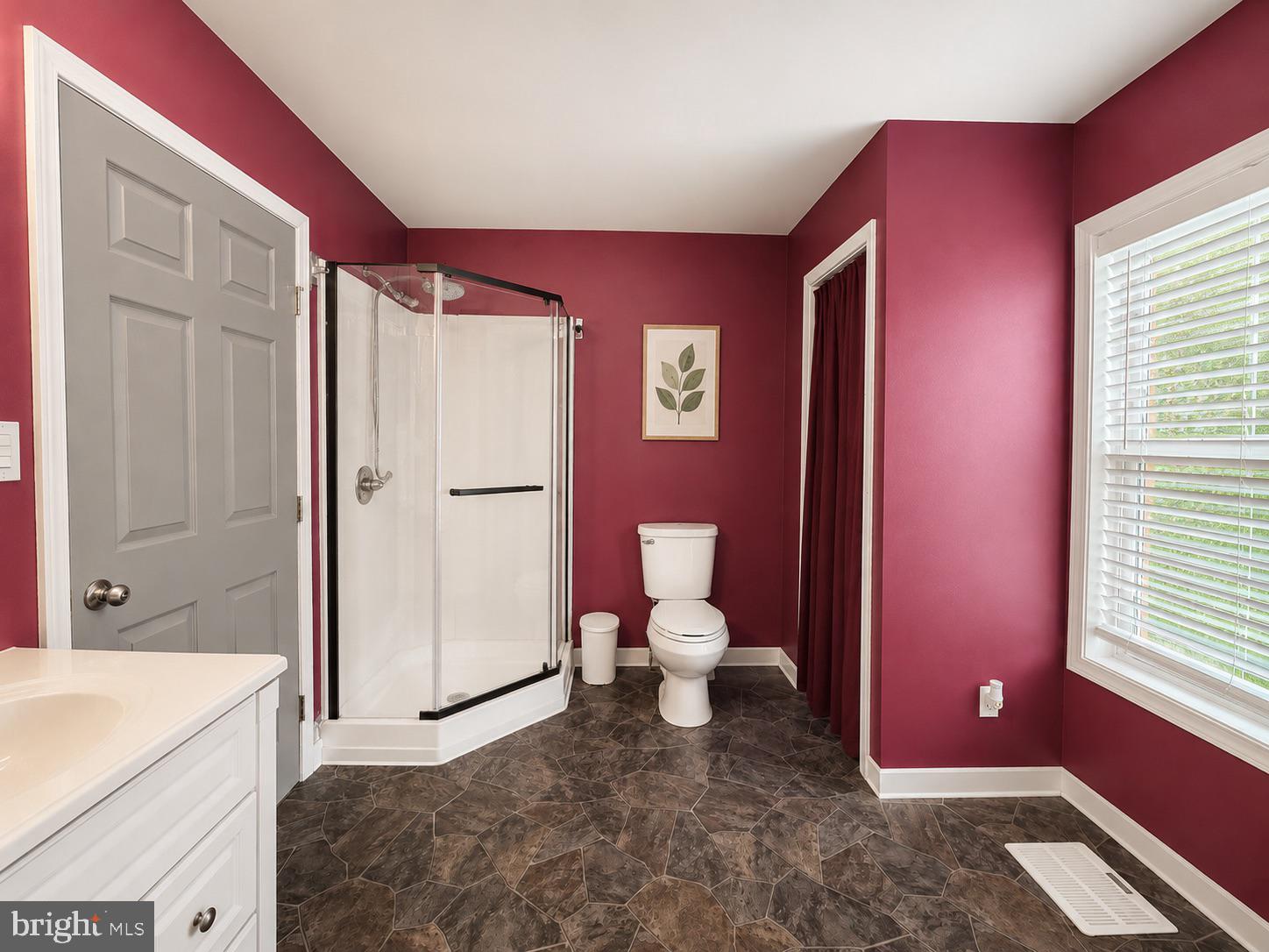 303 Flickerwood Road Kane, PA 16735 - Photo 15 of 25 a bathroom with a granite countertop toilet sink and shower