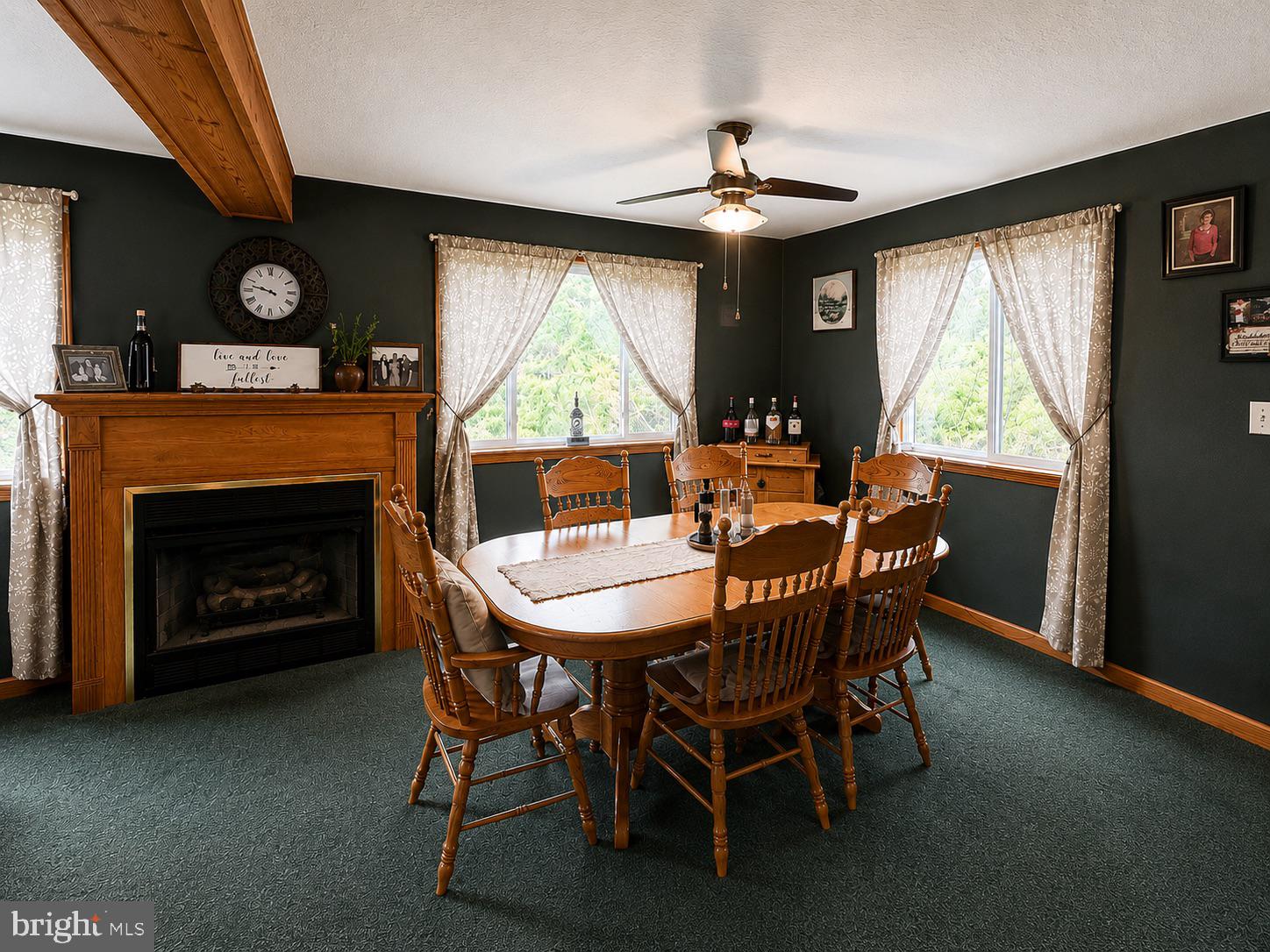 303 Flickerwood Road Kane, PA 16735 - Photo 5 of 25 a dining room with furniture a fireplace and a large window