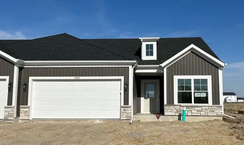 a front view of a house with a garage