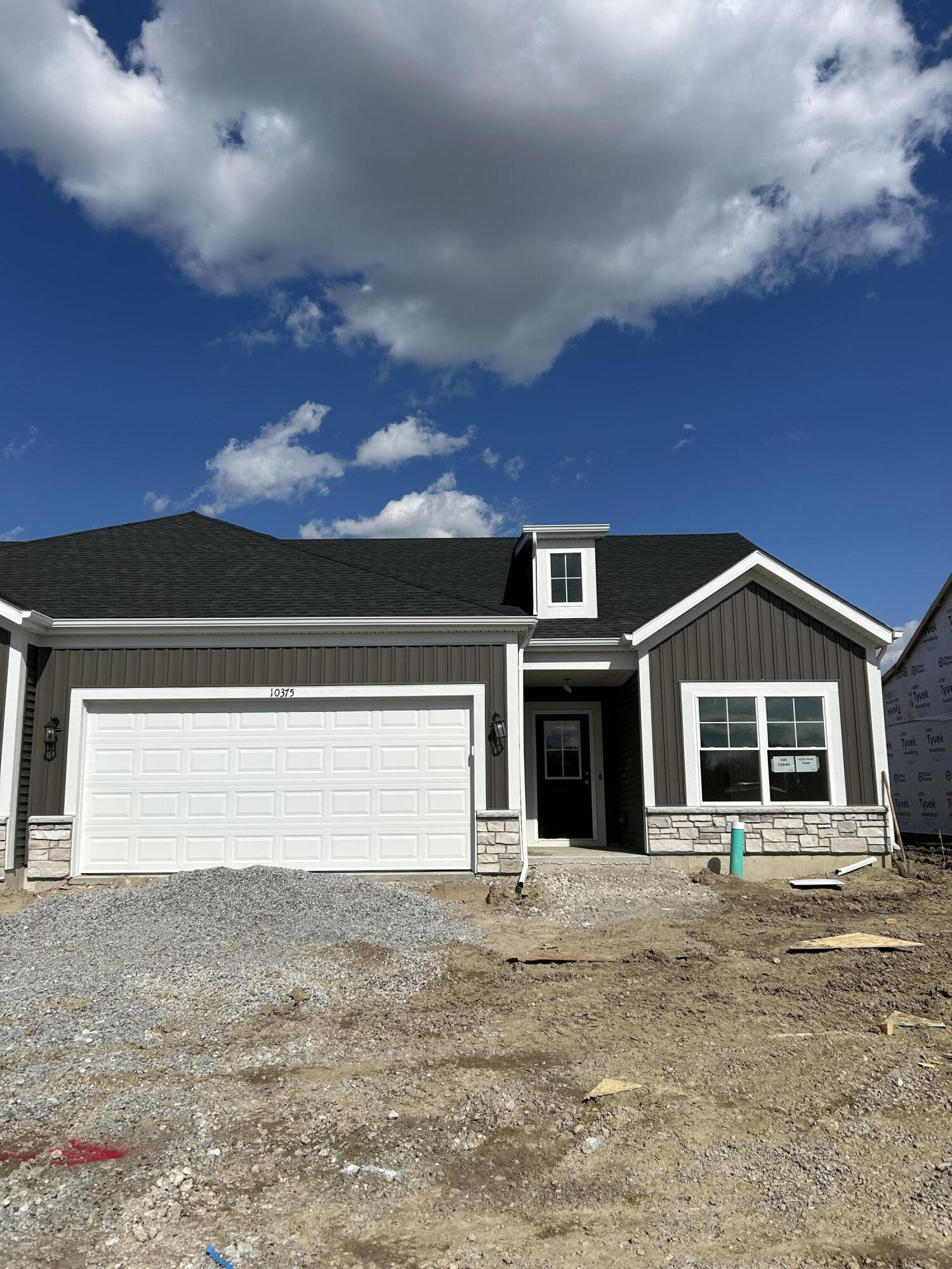 10375 Iowa Street Crown Point, IN 46307 - Photo 2 of 2 a front view of a house with a yard
