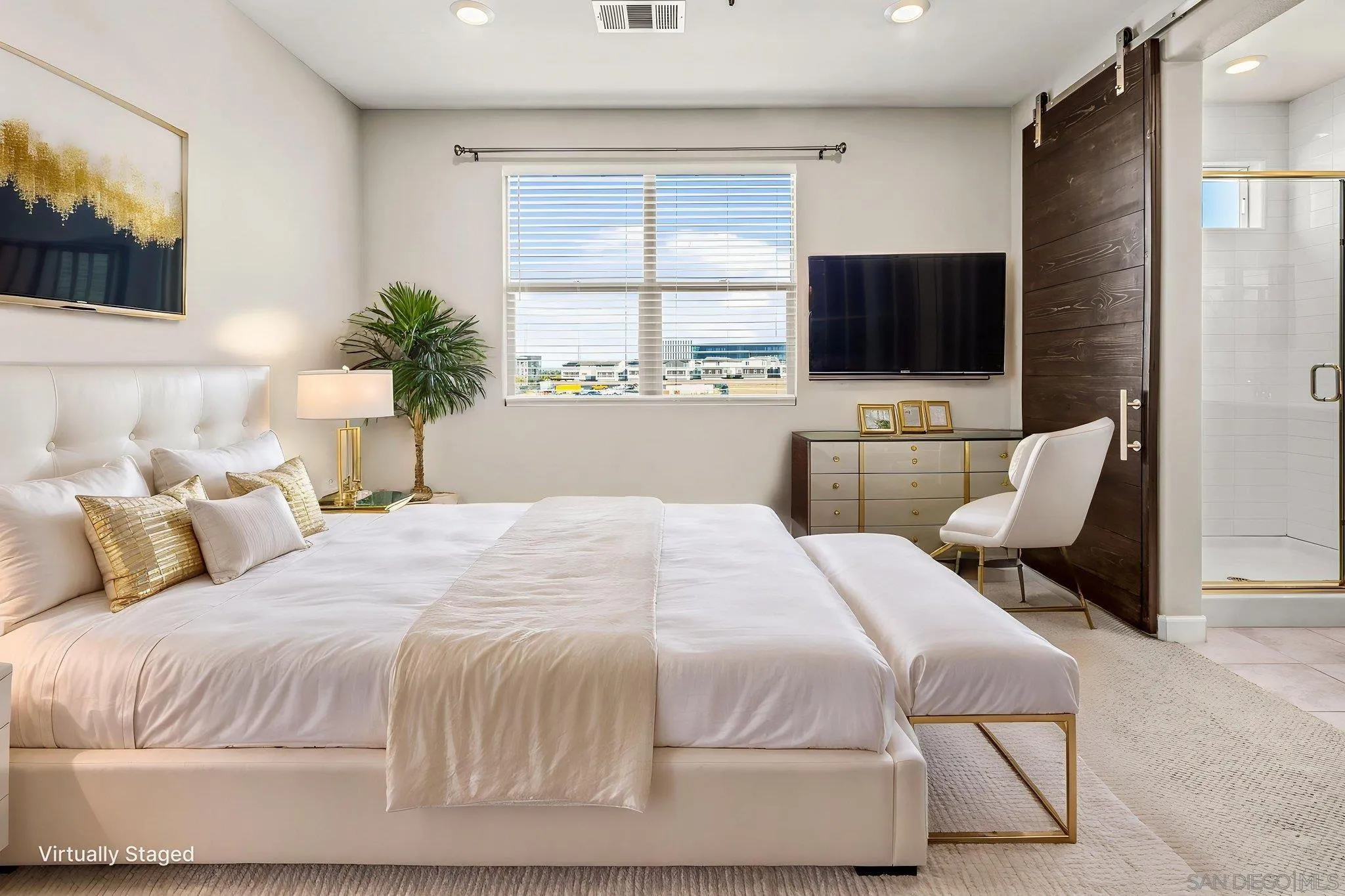 1922 Strata Street, Unit 5 Chula Vista, CA 91915 - Photo 11 of 45 a bedroom with a large bed and a flat screen tv