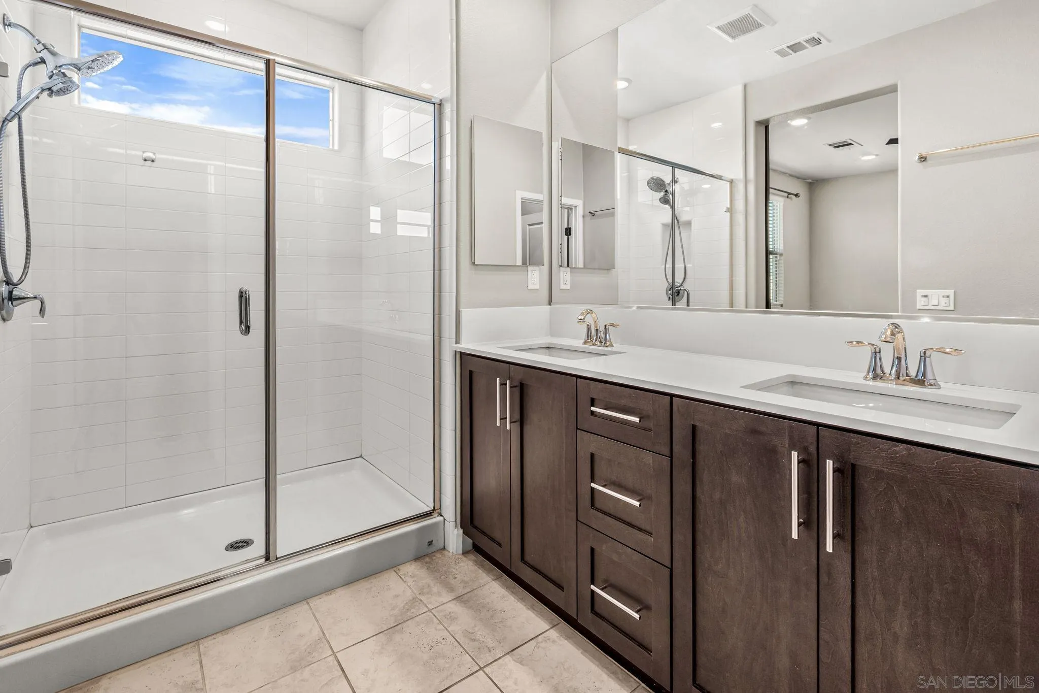 1922 Strata Street, Unit 5 Chula Vista, CA 91915 - Photo 12 of 45 a bathroom with a double vanity sink mirror and shower