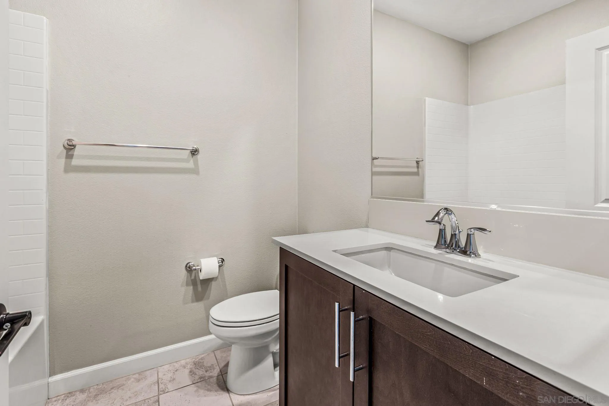 1922 Strata Street, Unit 5 Chula Vista, CA 91915 - Photo 20 of 45 a bathroom with a sink a toilet and a mirror