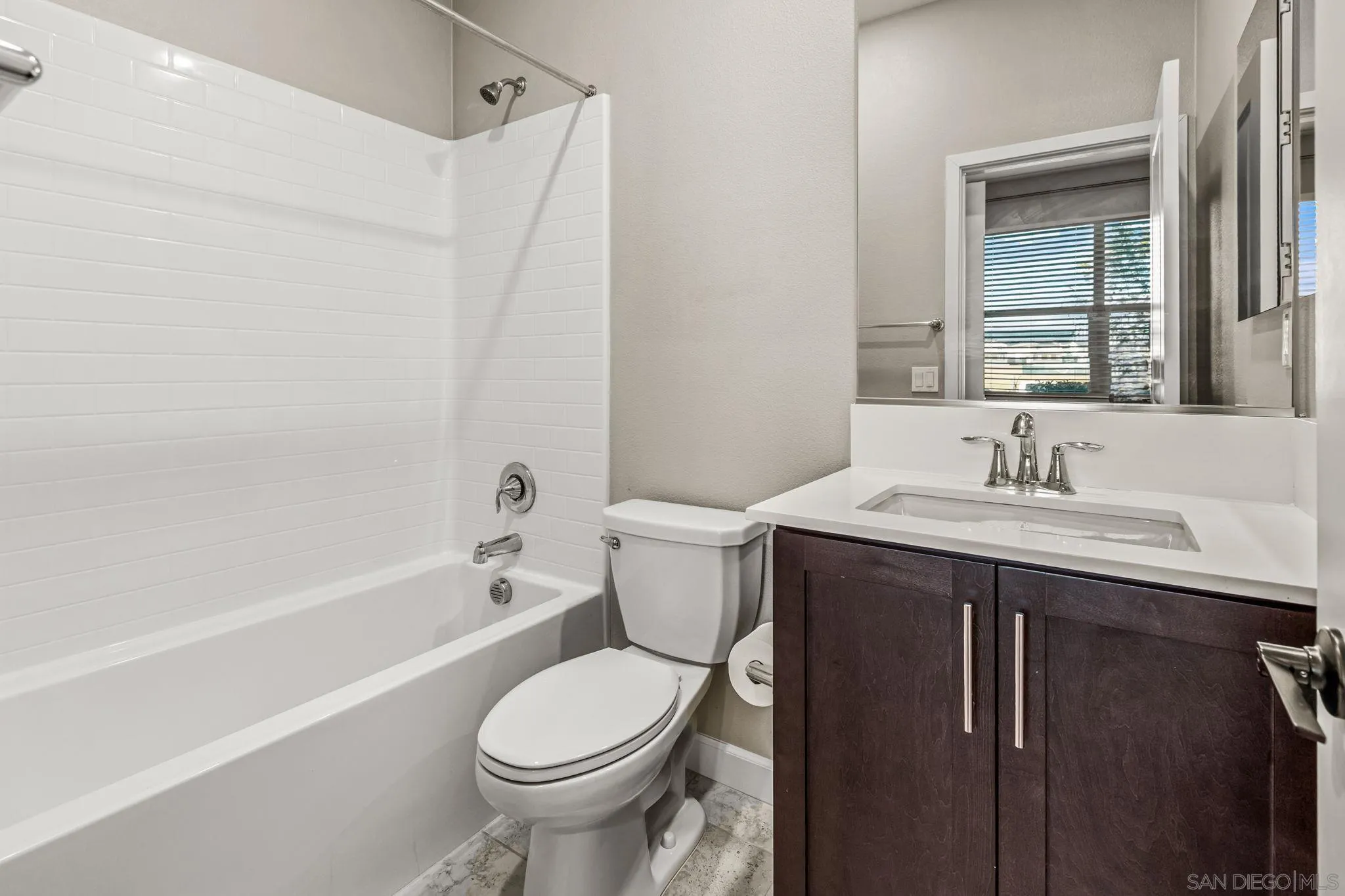 1922 Strata Street, Unit 5 Chula Vista, CA 91915 - Photo 23 of 45 a bathroom with a sink toilet and shower