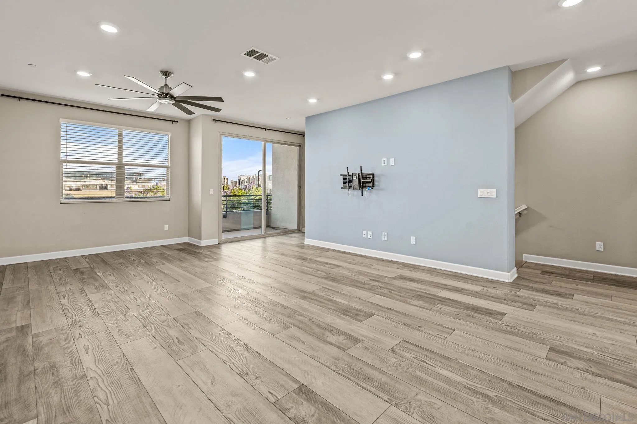 1922 Strata Street, Unit 5 Chula Vista, CA 91915 - Photo 8 of 45 an empty room with wooden floor and windows