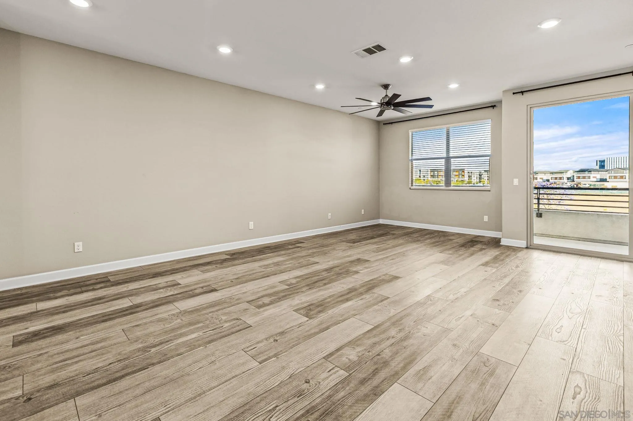 1922 Strata Street, Unit 5 Chula Vista, CA 91915 - Photo 9 of 45 wooden floor in an empty room with a window