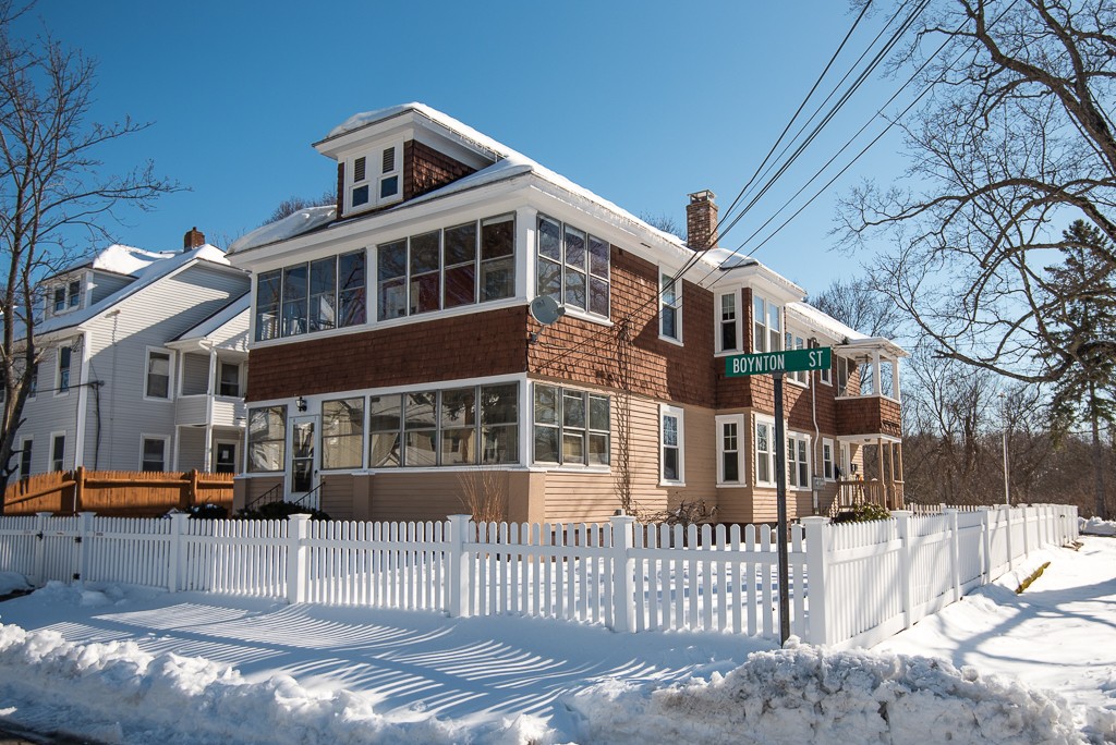 7-9 Boynton Street Clinton, MA 01510 - Photo 1 of 28 a front view of a building with a iron gate